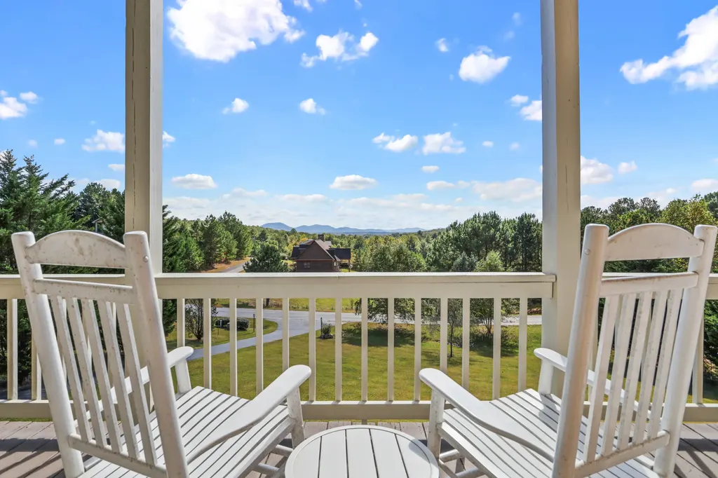 Two deck chairs facing the Blue Ridge mountains at dusk from Peace of Tranquility